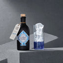 Illusionist Masquerade Bottle and Blue Gin Cocktail in a Glass
